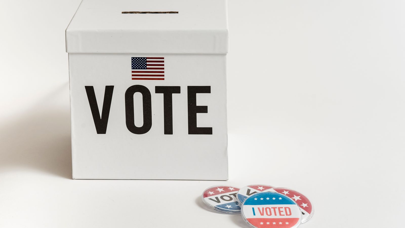 Ballot box marked vote with I voted stickers beside it
