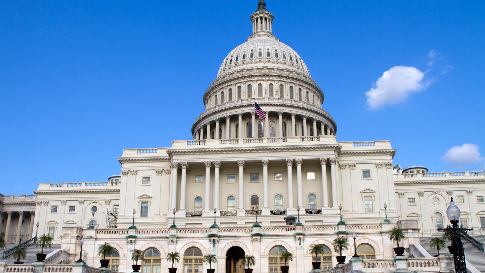 The United States Capitol building under a clear blue sky