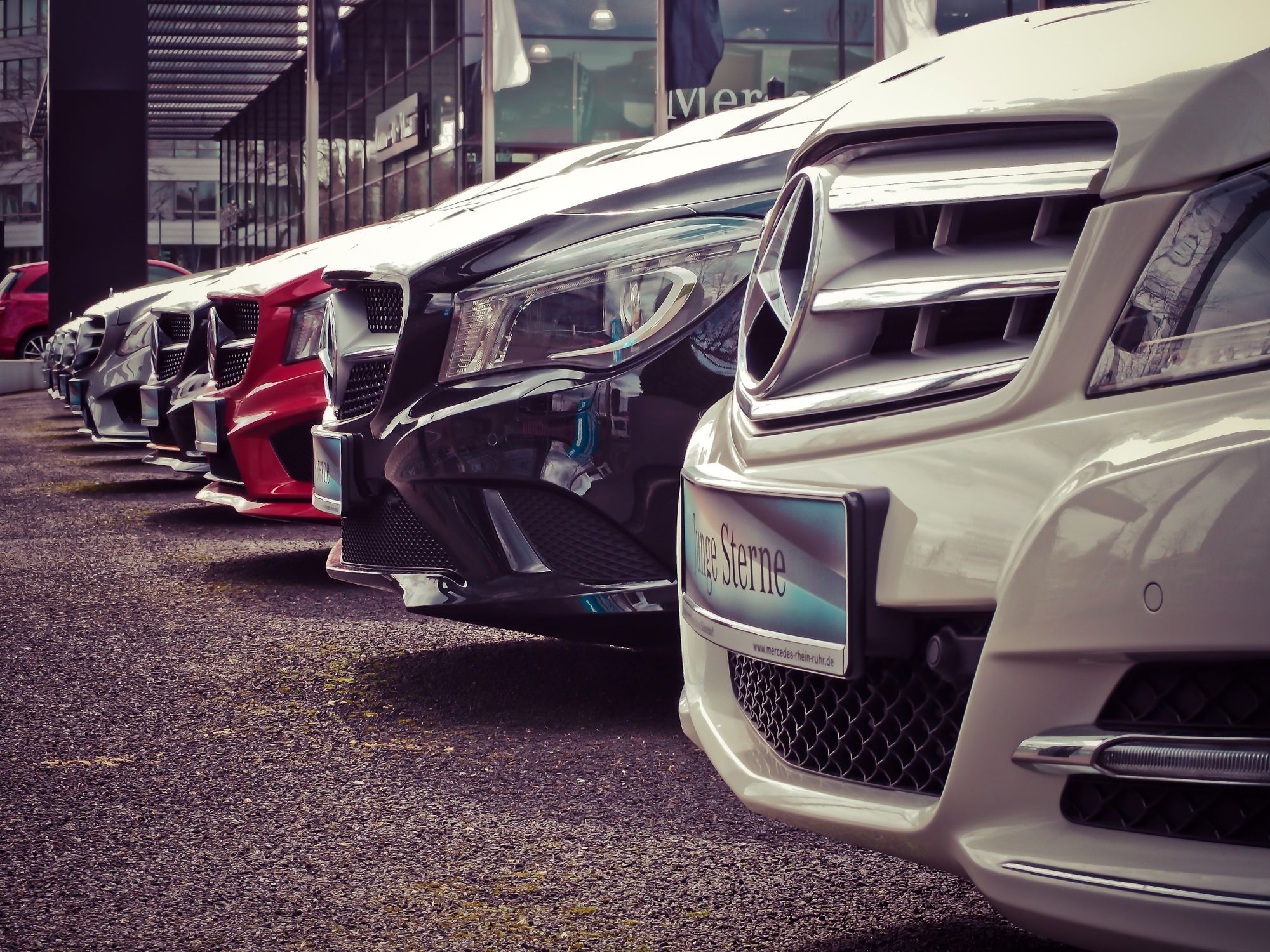 Modern car dealership showroom with luxury vehicles