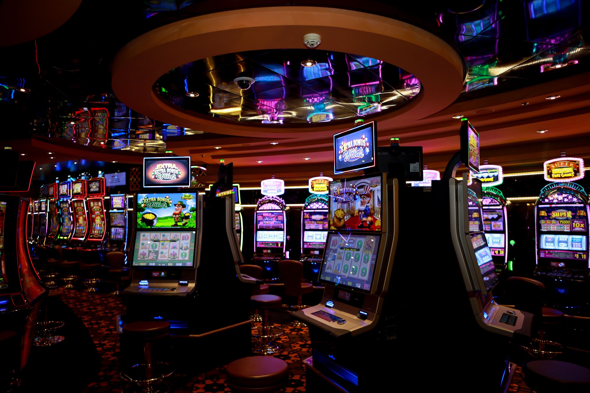 Luxury casino floor with slot machines and gaming tables