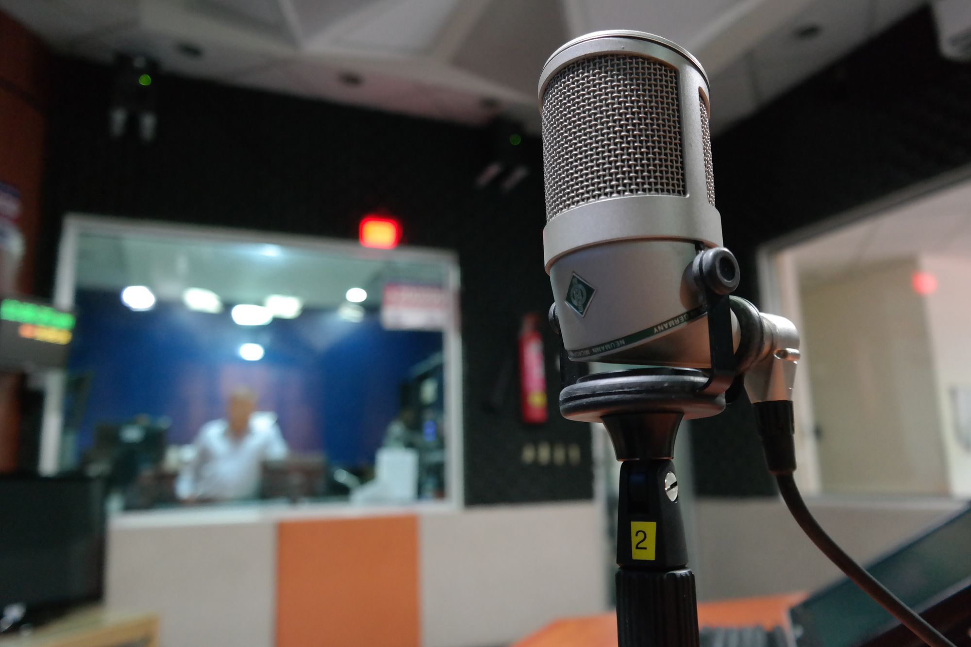 Professional recording studio microphone and mixing desk used for campaign spot production